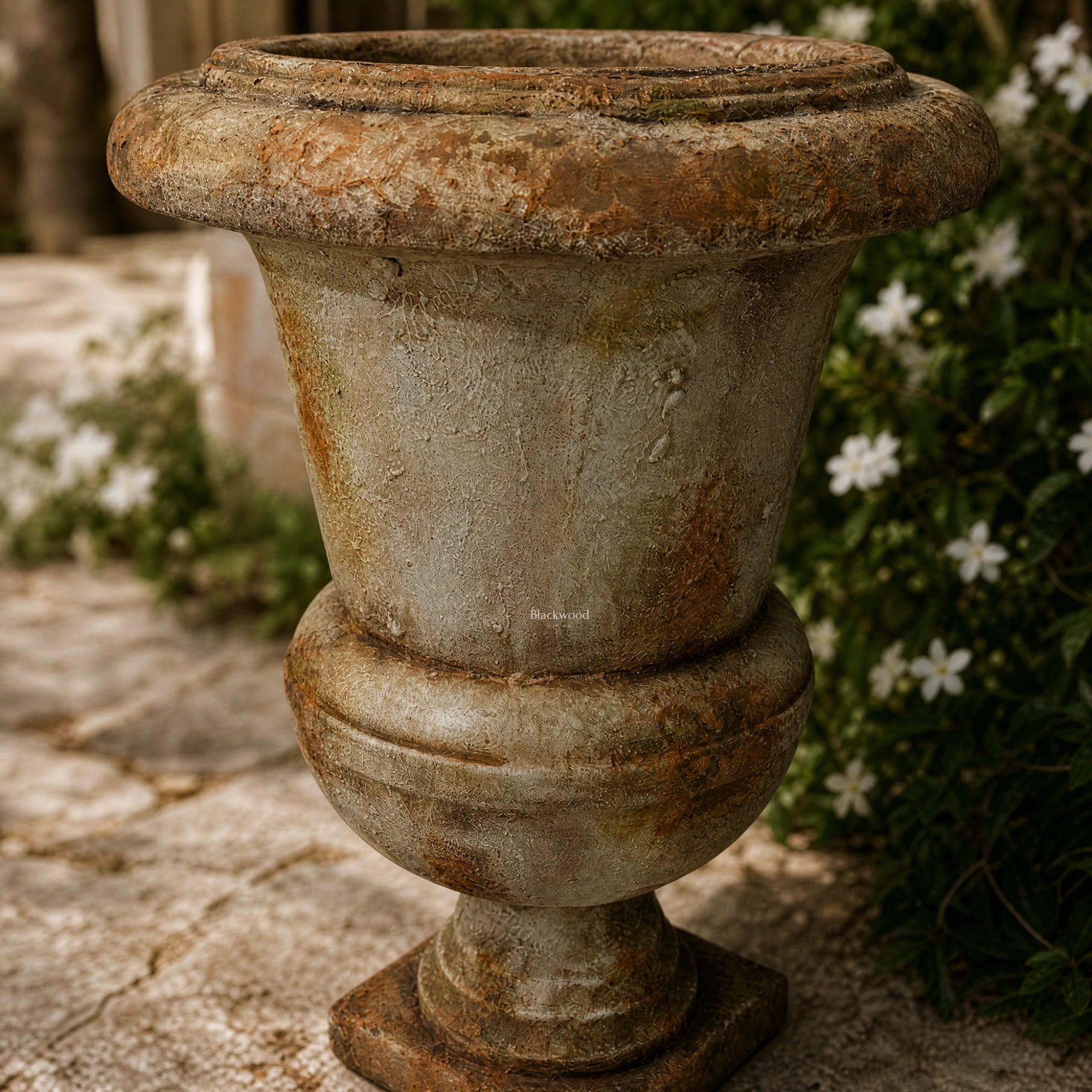 Provence Urn: antique marble-look magnesia garden urn with weathered finish for indoor and outdoor decor.
