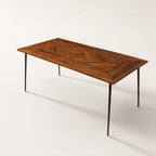 Havana Dining Table 180cm with reclaimed mango wood in walnut finish, chevron parquet top, slim black metal legs.