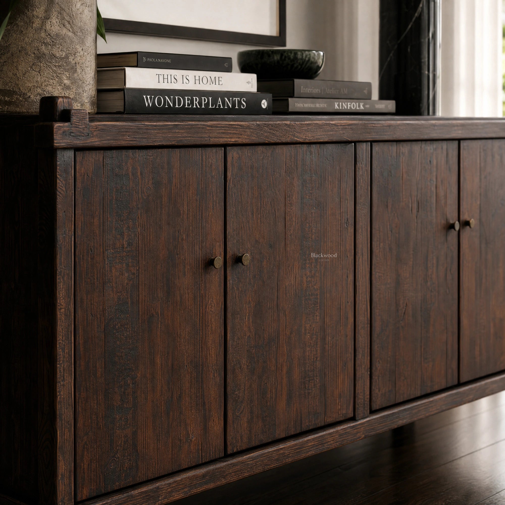 Millhouse Sideboard in solid fir wood with warm timber finish; Blackwood Plantation collection, books on top.