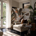 Brasilia Room Divider with tropical botanical panels featuring large leaves and Bird of Paradise in a living room.