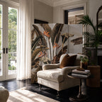 Brasilia Room Divider with tropical botanical panels featuring large leaves and Bird of Paradise in a living room.