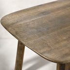 Pure Hawaii Dining Table in reclaimed oak with a softly weathered finish, solid timber construction, rounded corners.
