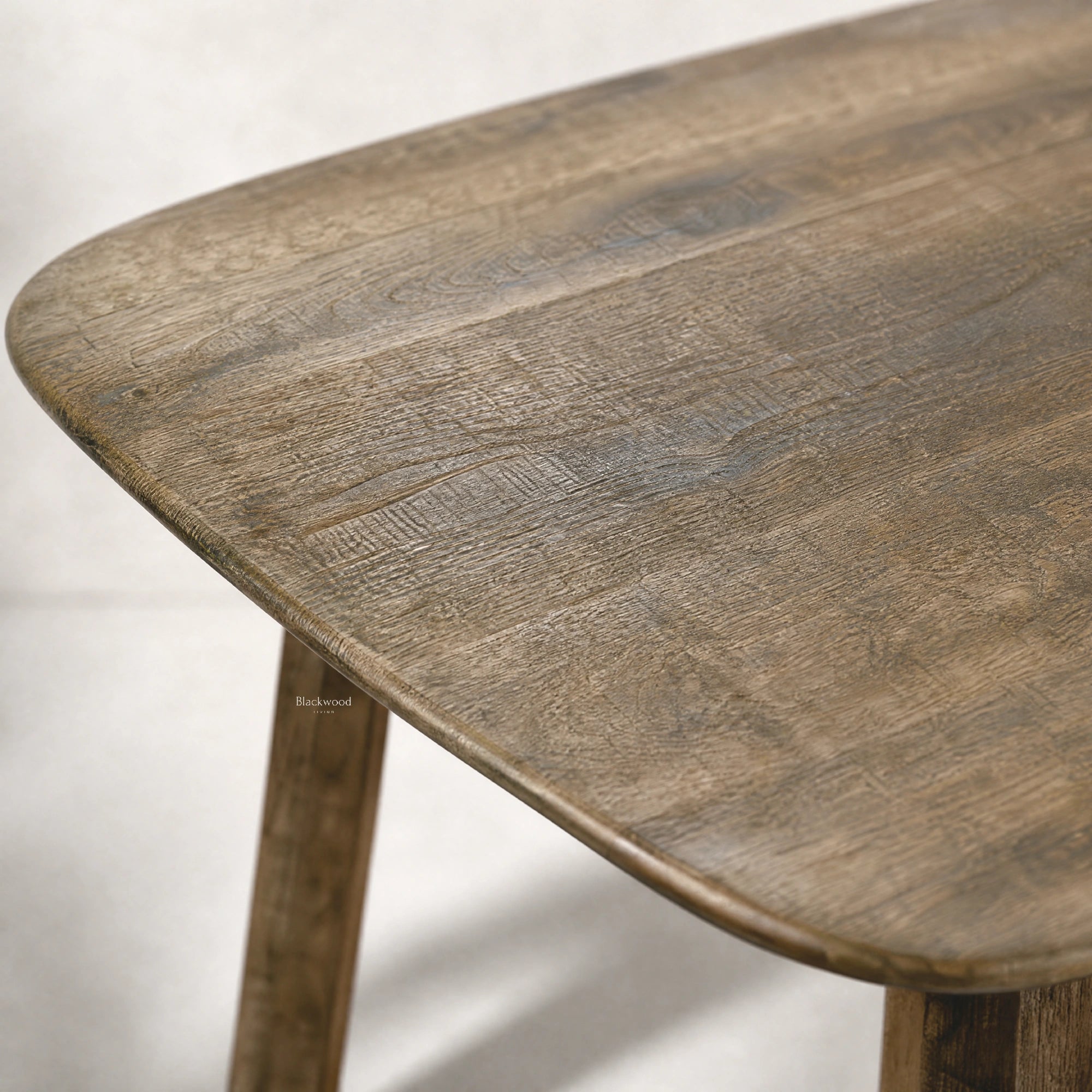 Pure Hawaii Dining Table in reclaimed oak with a softly weathered finish, solid timber construction, rounded corners.