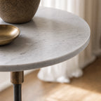 Mayfair Marble Side Table with crisp white marble top and slender black iron pedestal.