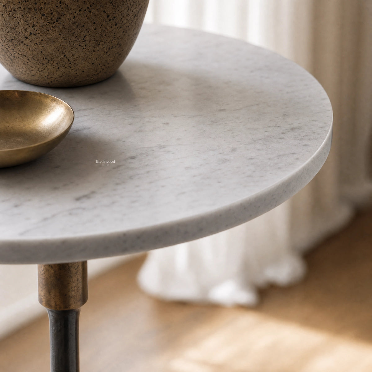 Mayfair Marble Side Table with crisp white marble top and slender black iron pedestal.