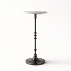 Mayfair Marble Side Table with a white marble top and slender black iron pedestal on a round base.