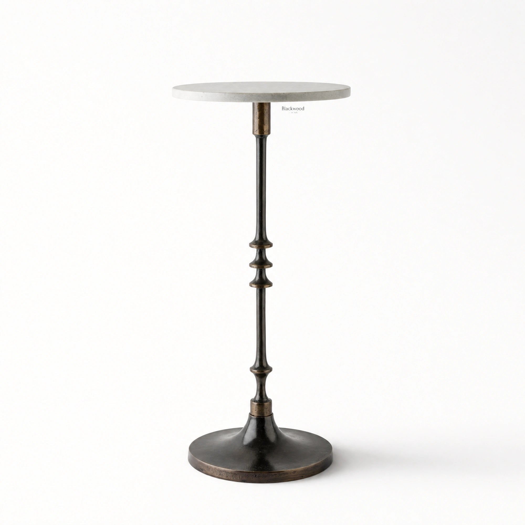 Mayfair Marble Side Table with a white marble top and slender black iron pedestal on a round base.