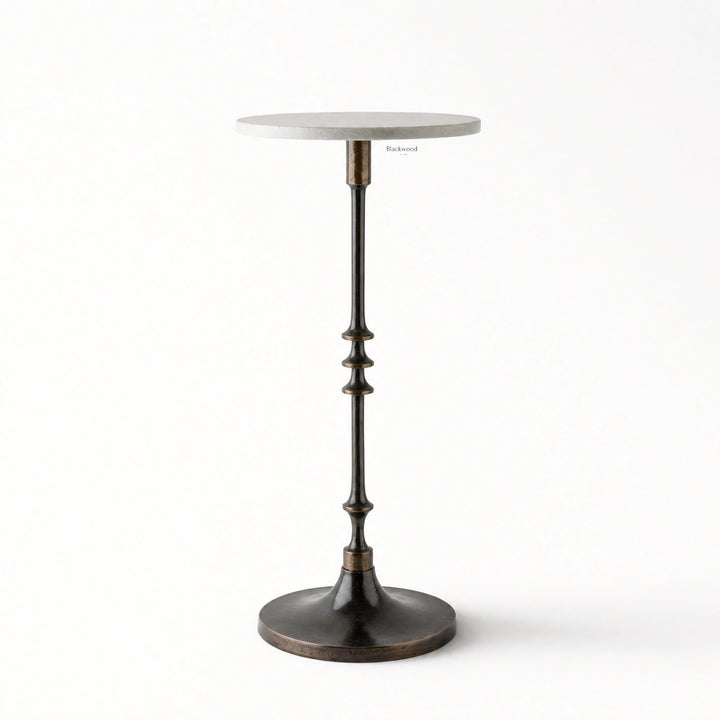 Mayfair Marble Side Table with a white marble top and slender black iron pedestal on a round base.