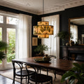 Belize Lightshade bamboo lamp with tropical botanical print, casting warm glow in a dark elegant dining room.