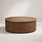 Reed Round Coffee Table in reclaimed elm with warm grain and ribbed cylindrical base.
