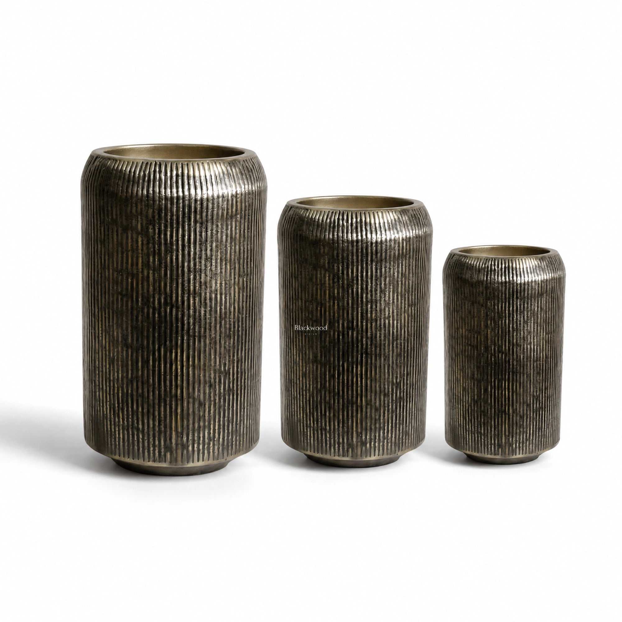 Sumatra Planters Set/3: three ribbed aluminium planters in antique brass finish.