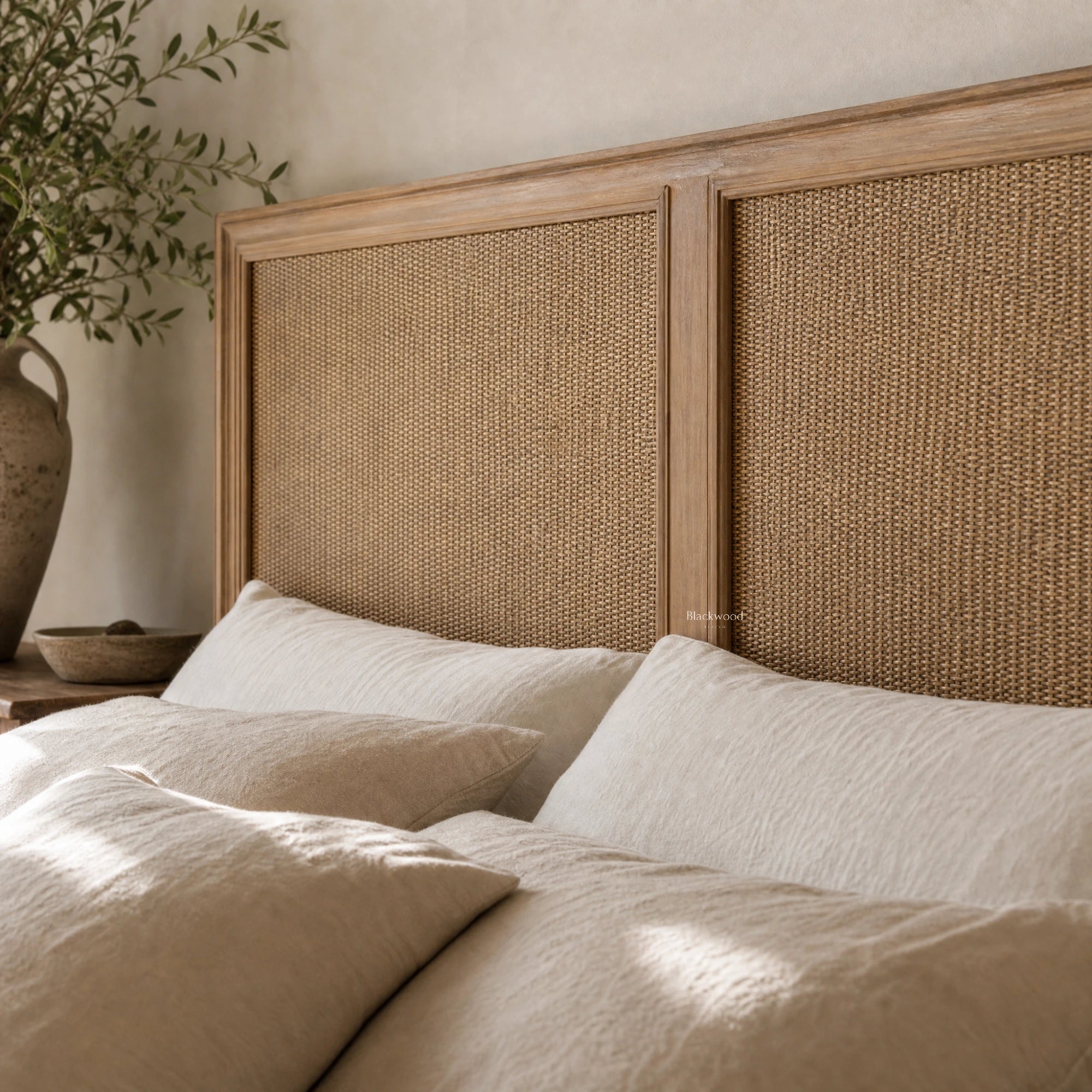 Willow Headboard with Bayur wood frame and woven natural rattan panels in a neutral bedroom.