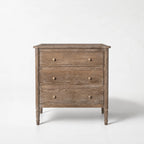 Saltwood Bedside Table in washed oak with a softly weathered finish, ridged detailing, coastal-inspired warmth.