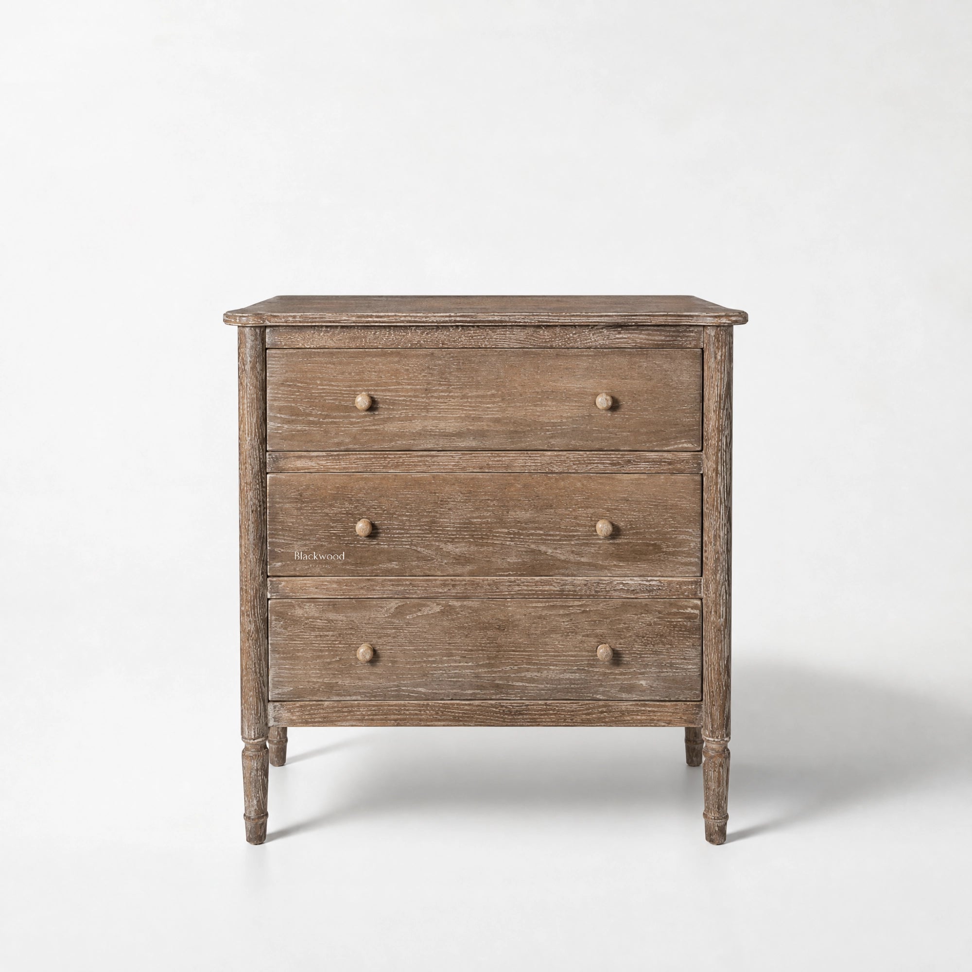 Saltwood Bedside Table in washed oak with a softly weathered finish, ridged detailing, coastal-inspired warmth.