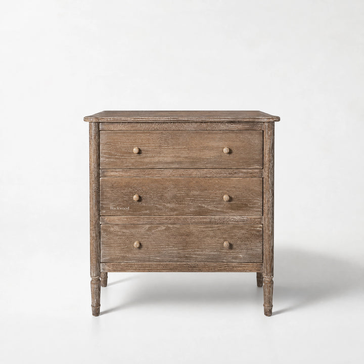 Saltwood Bedside Table in washed oak with a softly weathered finish, ridged detailing, coastal-inspired warmth.