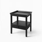 Colombo Bedside Table in black alder with tray top, open middle shelf, and bottom drawer.