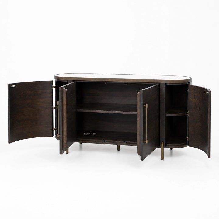 Meridian Sideboard in dark mango wood with brass detailing, curved silhouette, and a mirrored top.