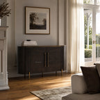 Meridian Sideboard in rich mango wood with brass detailing and a mirrored top, in a sunlit living room.