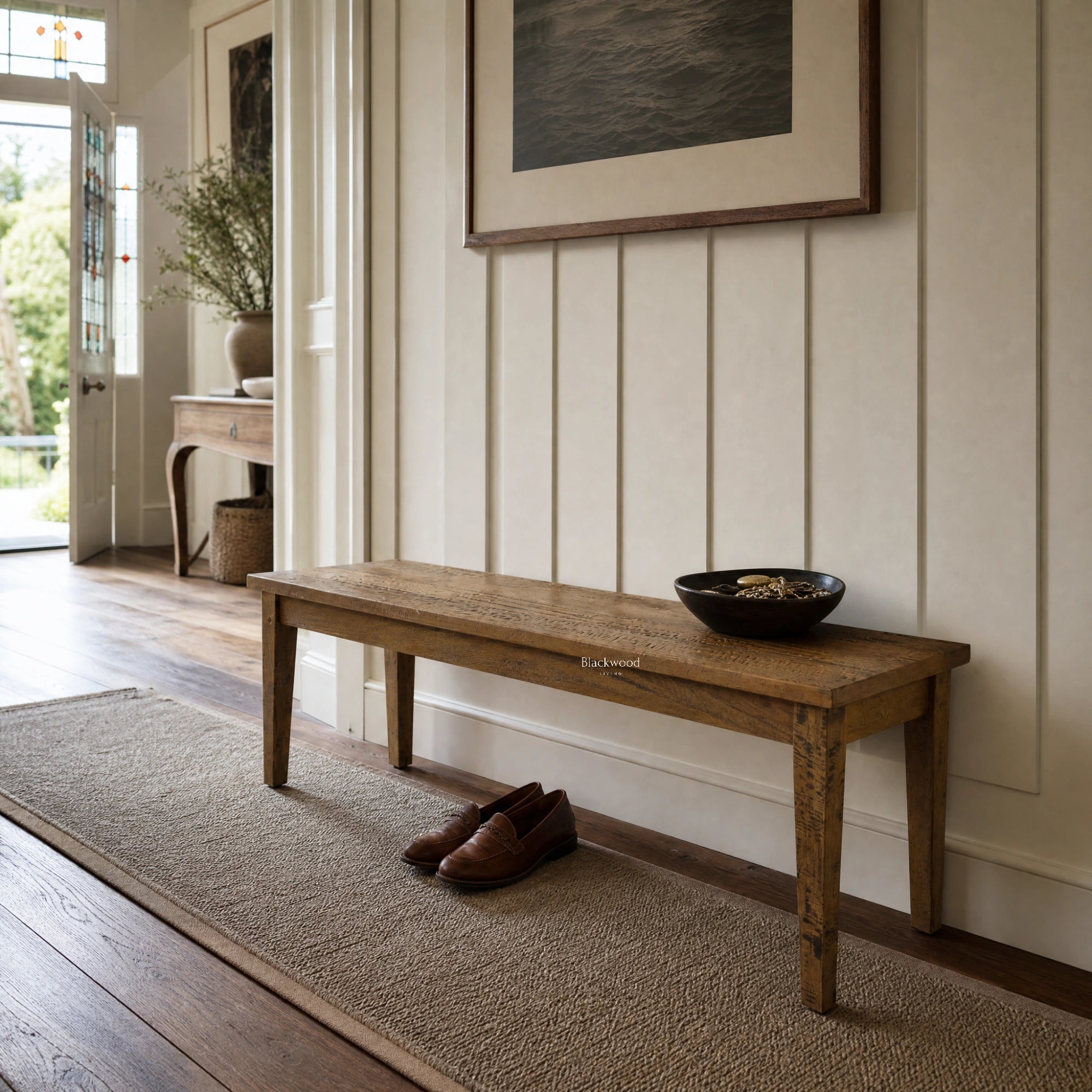 Renwick Bench Seat in a sunlit entryway, crafted from solid mango wood with clean lines and rich grain.