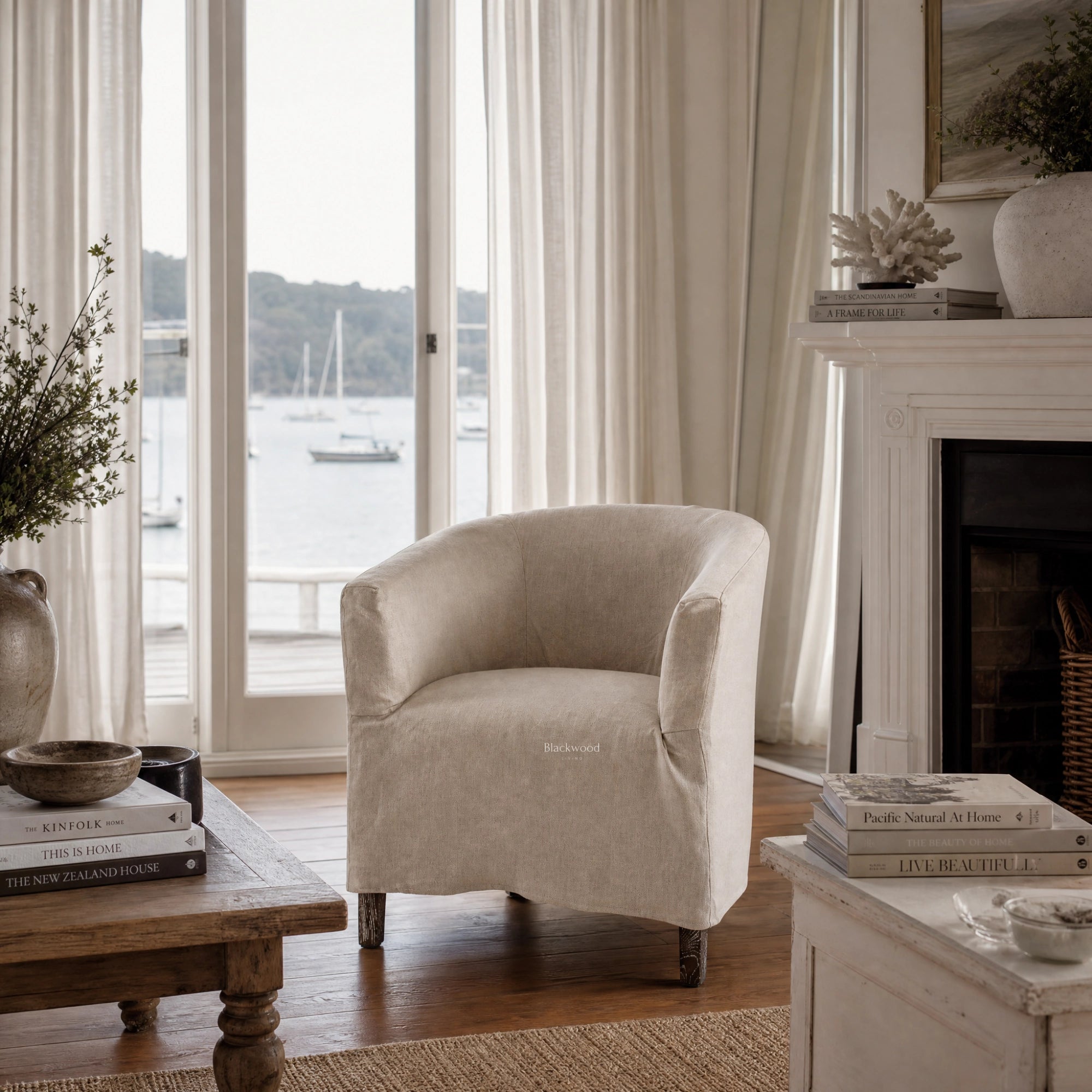 Stonehaven Accent Chair with linen slipcover and solid timber frame in a light Hamptons-style living room.