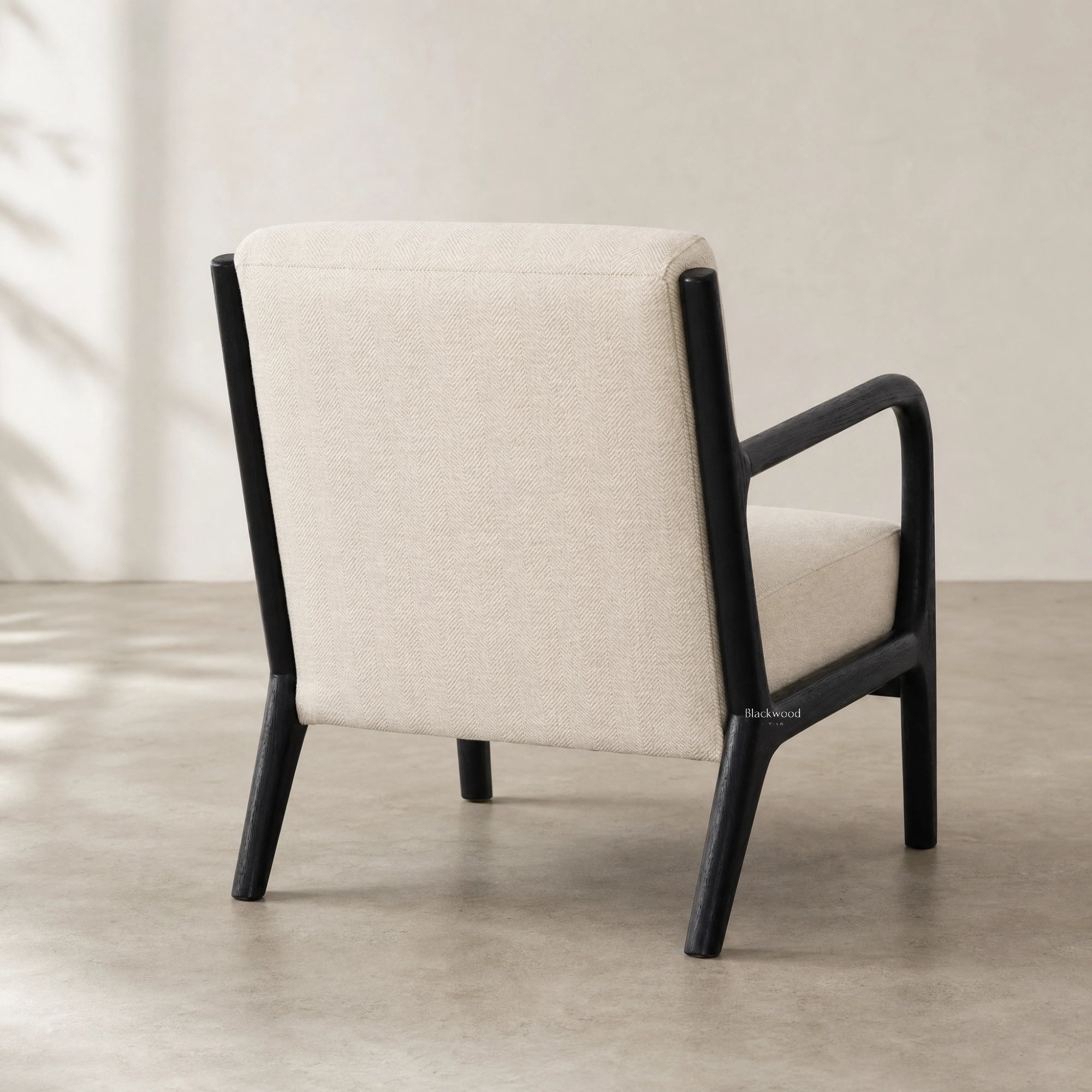 Java Occasional Chair in cream herringbone fabric with a black wood frame.