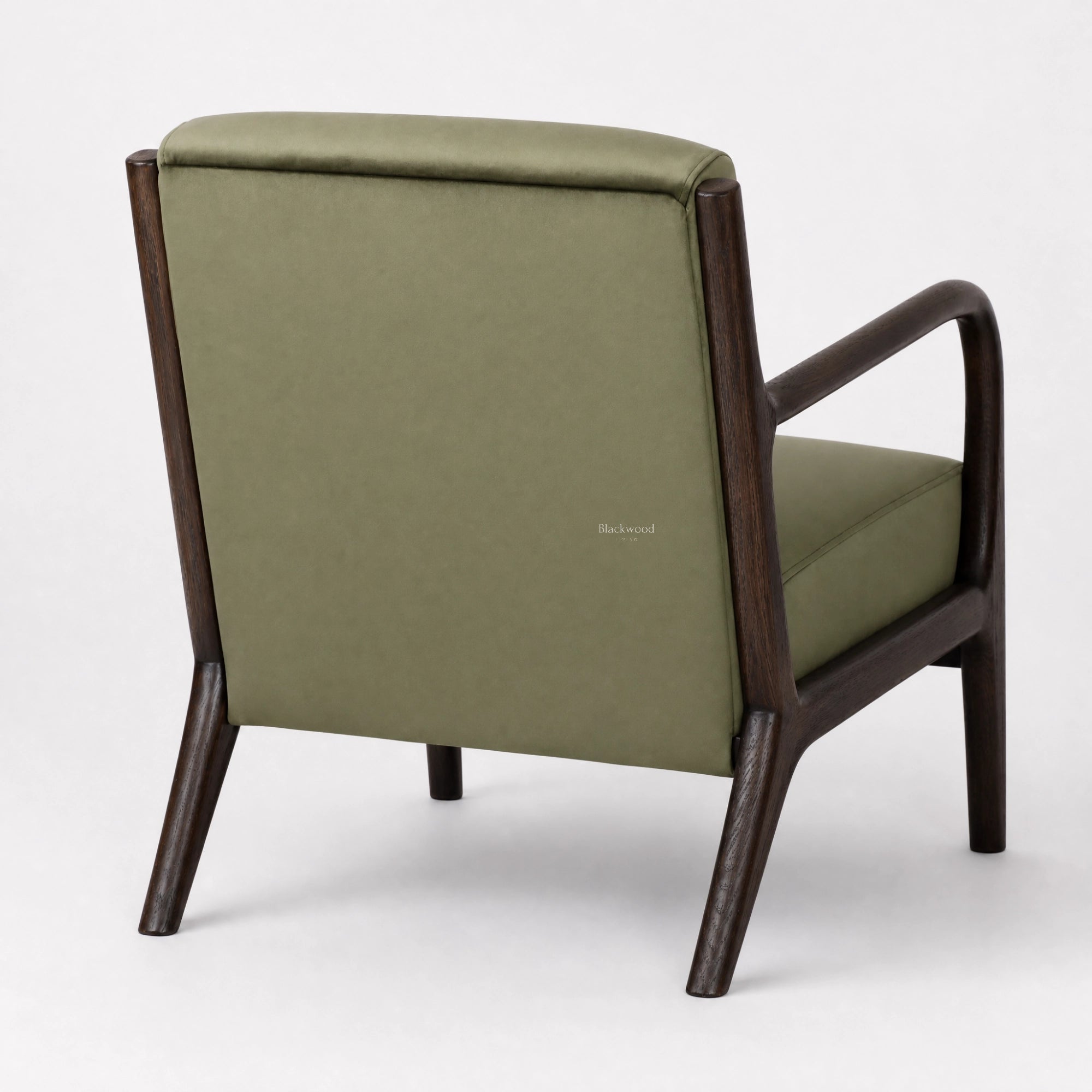 Java Occasional Chair with a dark oak frame and rainforest green velvet upholstery.