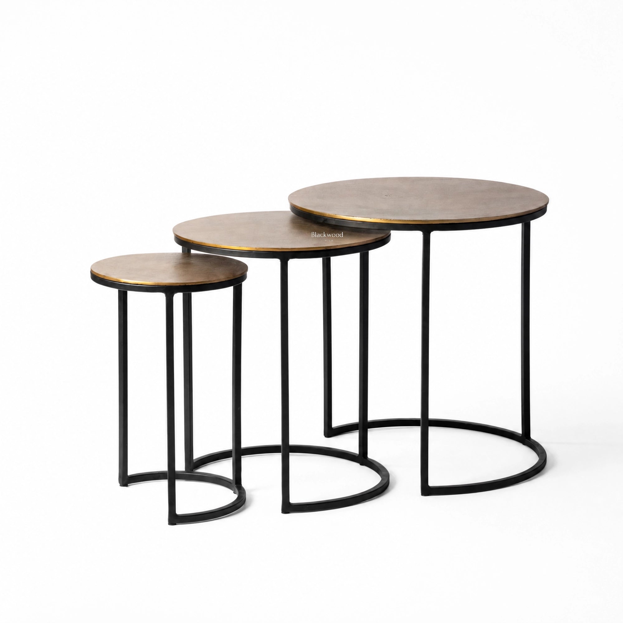 Calcutta nesting side tables set of 3 with slender black iron frames and softly aged aluminium tops.