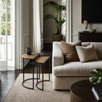 Agra Side Tables Set/2 with textured wood tops and black metal frames beside a beige sofa in a modern living room.