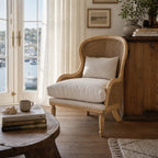 Bayview Lounge Chair with solid ash frame, woven natural rattan, and linen upholstery in a coastal living space.