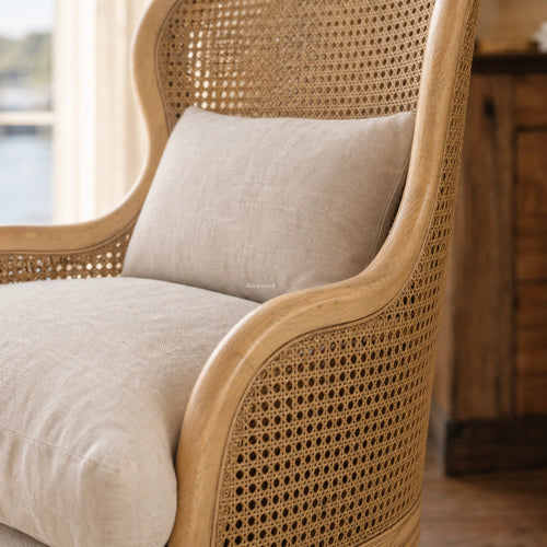 Bayview Lounge Chair with ash frame, woven natural rattan, and beige linen upholstery.