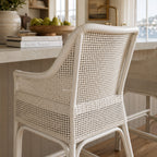 Singapore Counter Stool - White with woven rattan back and curved silhouette for coastal kitchen seating.