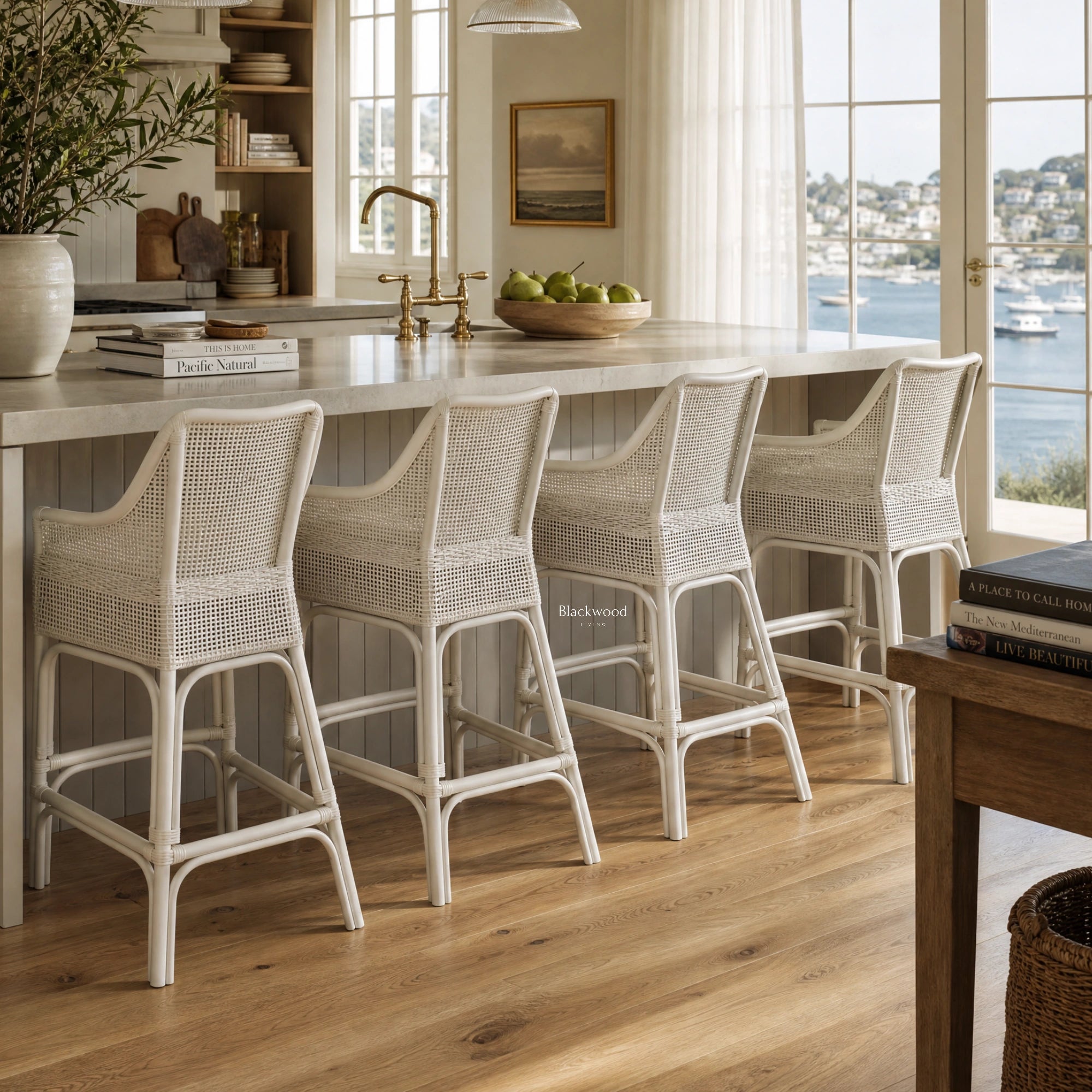 Singapore Counter Stool - White in woven natural rattan with a curved silhouette for coastal kitchen island.