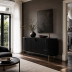 Valmont Curved Buffet in mango wood, sculpted silhouette, curved profile, fluted detailing, aged brass feet.