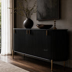 Valmont Curved Buffet in black with curved silhouette, fluted detailing, mango wood warmth, aged-brass feet.