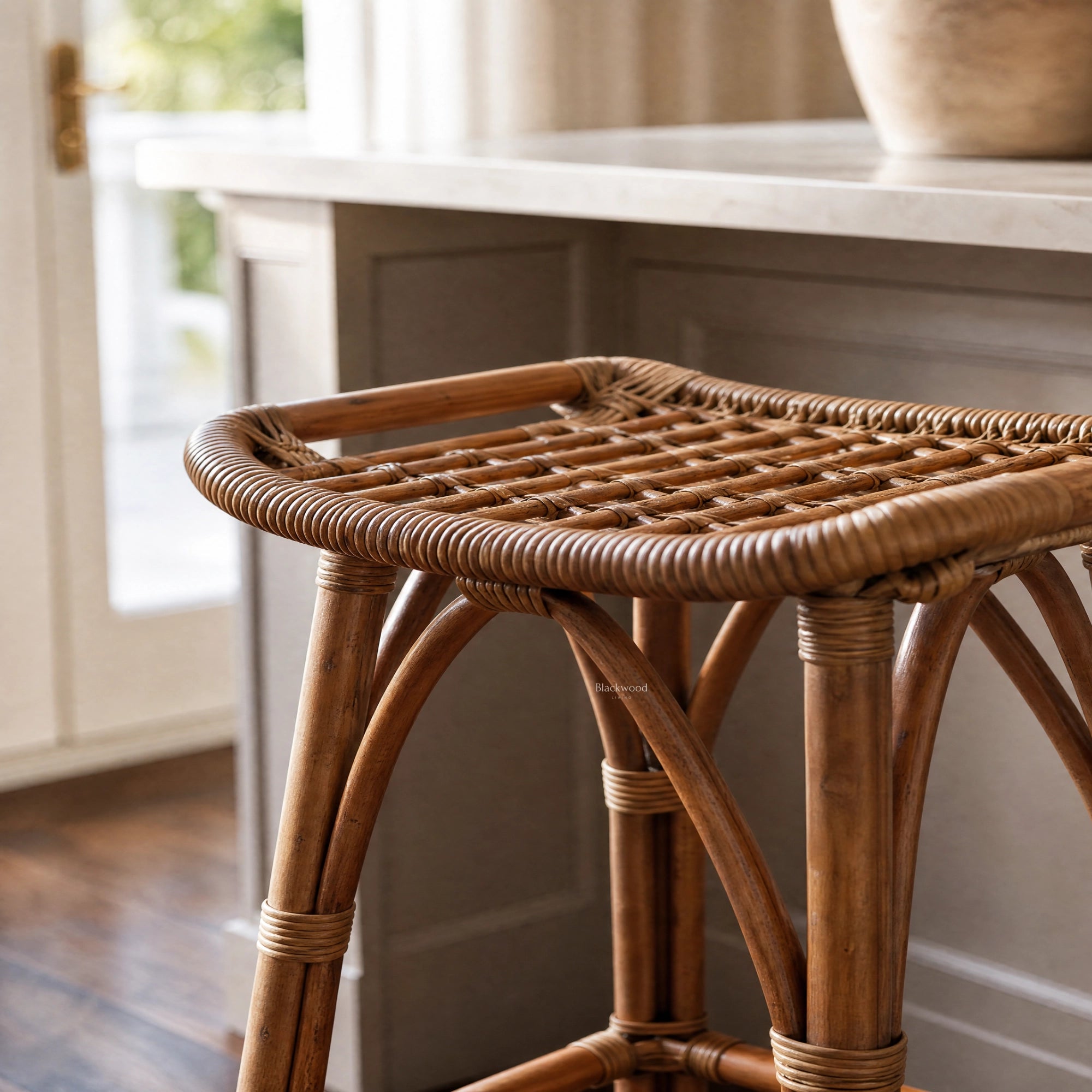 Sika Salsa rattan counter stool with natural woven seat and antique-toned finish, handcrafted from Indonesian rattan.