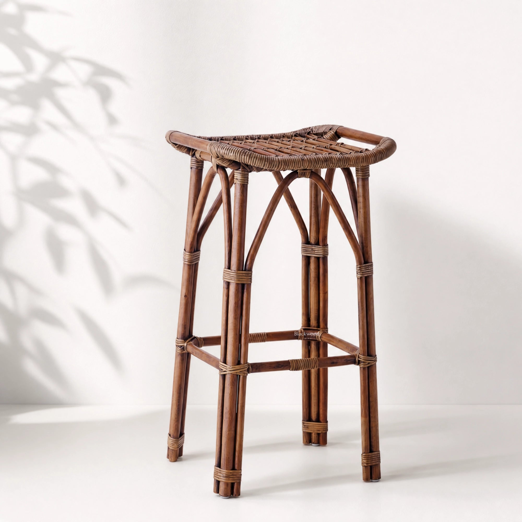 Sika Salsa Rattan Counter Stool, handwoven natural rattan with curved seat and antique finish.