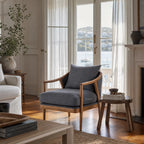 Westport Occasional Chair in Atlantic Blue with a solid timber frame and oak arms in a light coastal living room.