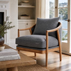 Westport Occasional Chair in Atlantic Blue with a generously cushioned seat, exposed timber frame and oak arms.
