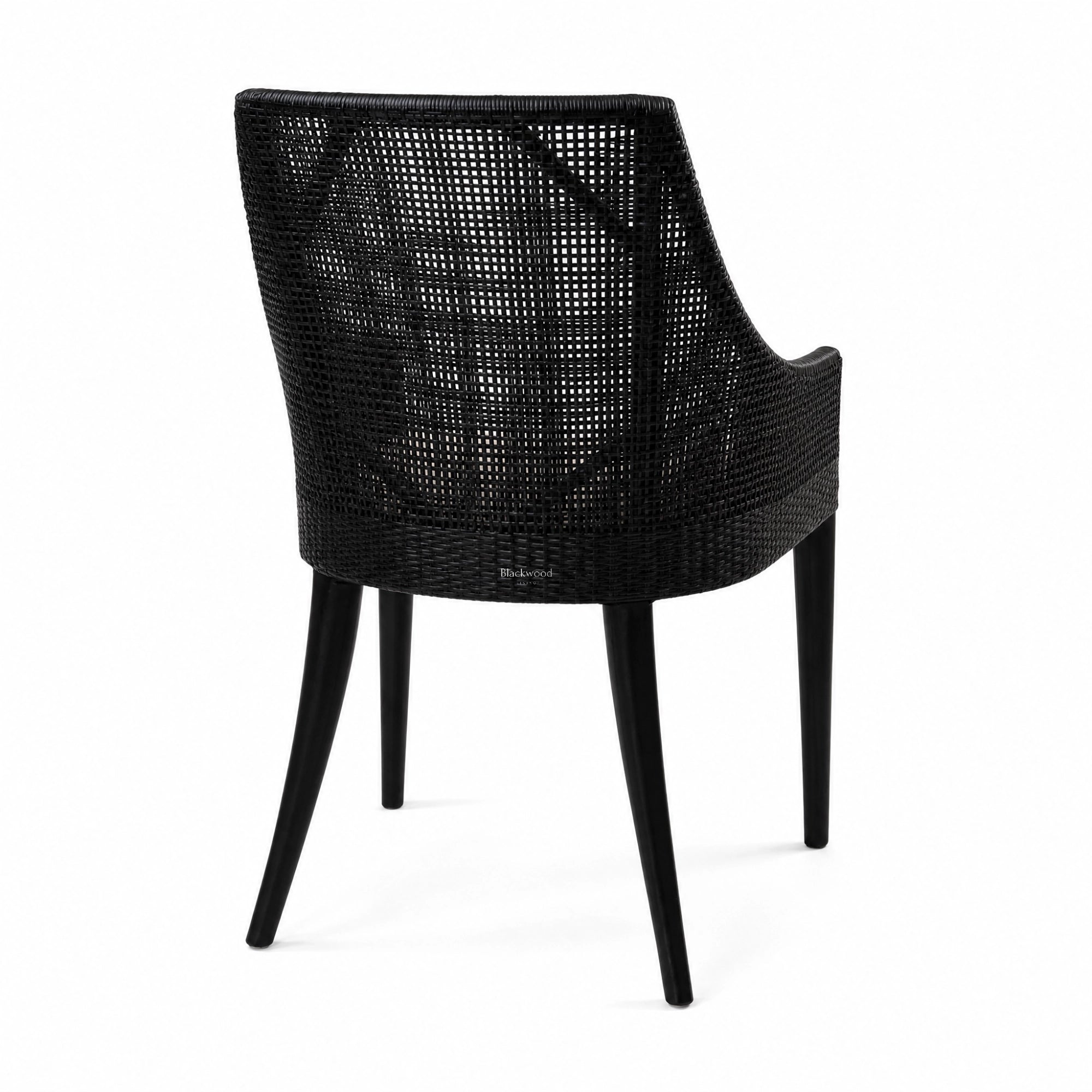 Barbados Dining Chair in black woven rattan with a curved back and arms for plantation-inspired dining.