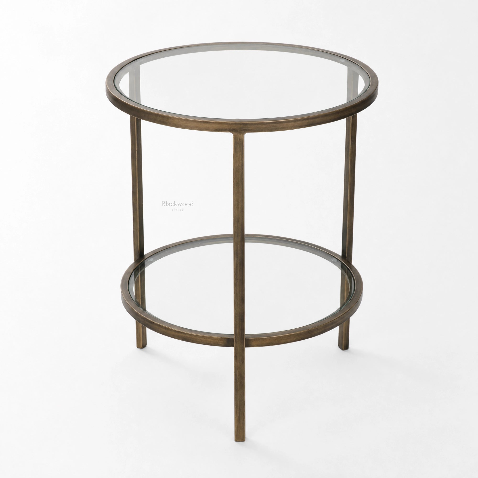 Belgrave Side Table in brass with two circular glass surfaces and slender iron frame.