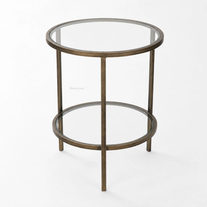 Belgrave Side Table in brass with two circular glass surfaces and slender iron frame.
