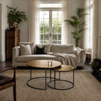 Harrington Coffee Table Set/2: two circular tables with textured antique-brass tops on black metal bases.