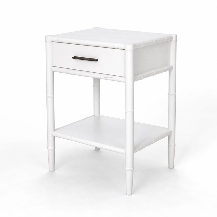 Rangoon Bedside Table in white with a single drawer and lower shelf, bamboo-style frame.