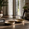 Madras Decorative Bowls Set/2: hammered aluminium bowls with brass finish in a stylish living room.