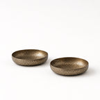 Madras decorative bowls set of two in aluminium with brass finish and hand-hammered texture.