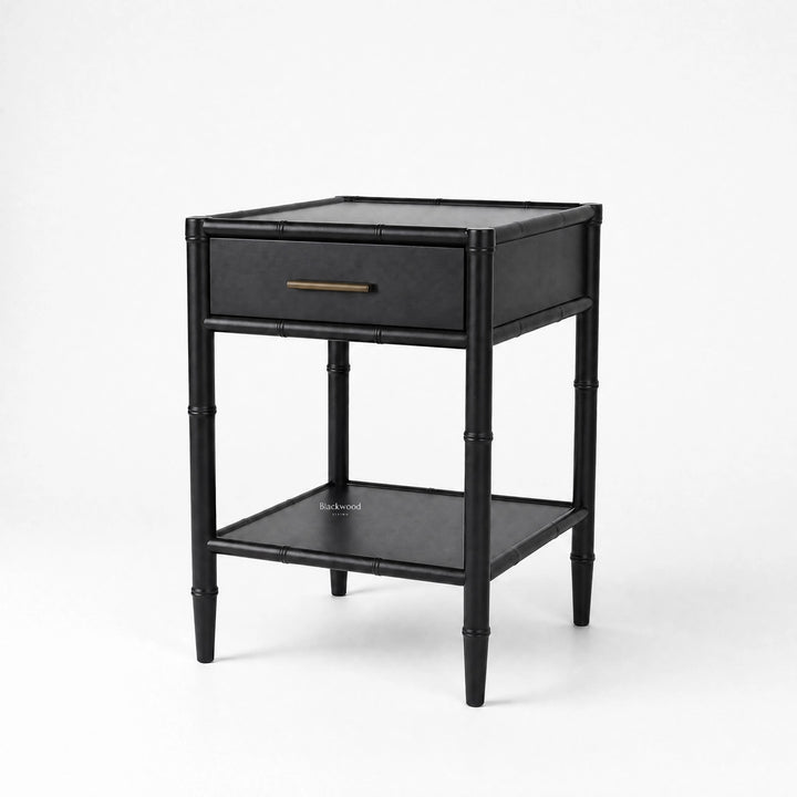 Rangoon Bedside Table in black mahogany finish with bamboo-inspired frame and single brass-handle drawer.