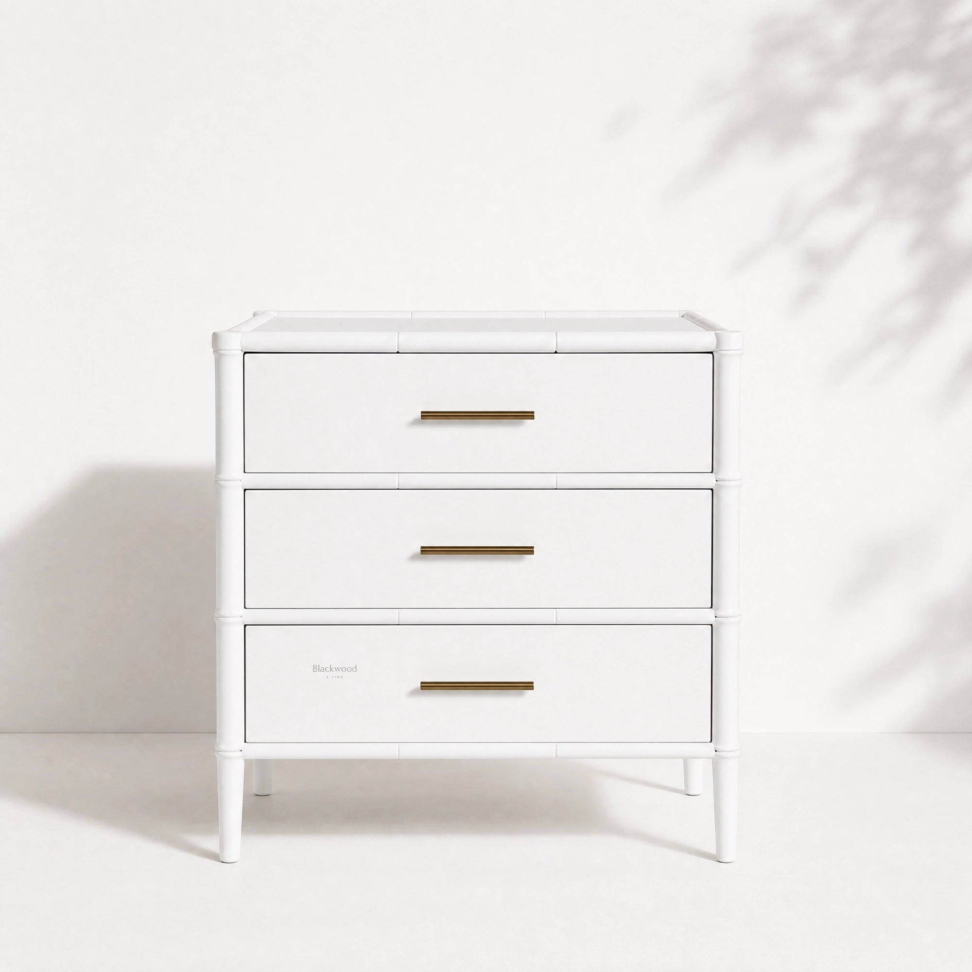 Rangoon 3-Drawer Bedside in white with brass handles and bamboo detailing.