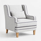 Anchorage Lounge Chair in Newport Stripe with purple piping and solid wood legs.