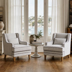 Anchorage Lounge Chairs Newport Stripe in a bright coastal living room with striped upholstery around a round table.