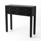 Black Penang hall table with slender profile, six drawers, and warm-toned metal handles for entryway or living space.